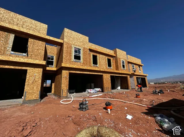 New construction featuring structural framing and window installations