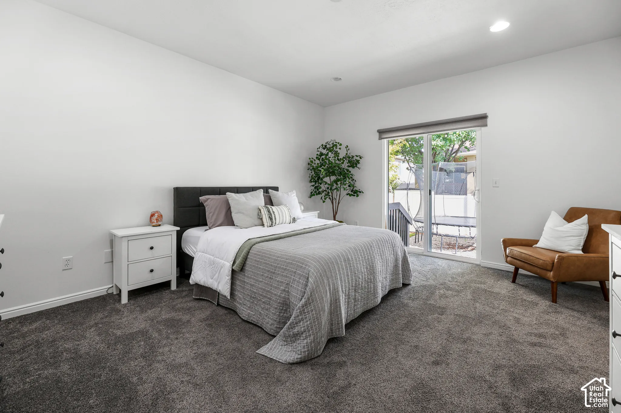 White walls with gray carpet flooring