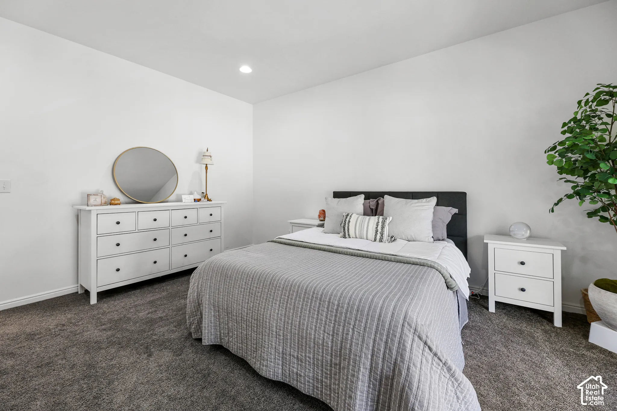 Soft grey carpeting and recessed lighting
