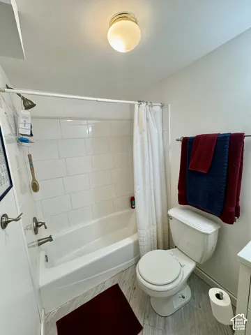 White subway tile shower surround with brushed nickel fixtures