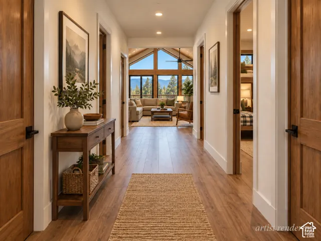 Wood-finish flooring throughout, with white trim and solid wood doors featuring matte black hardware