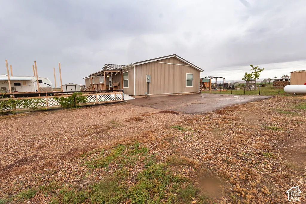 Expansive gravel driveway providing ample parking