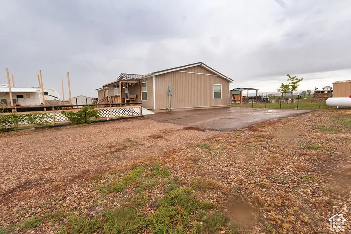 Expansive gravel driveway providing ample parking