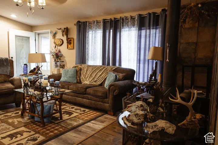 Wood-finish flooring with a multi-patterned area rug