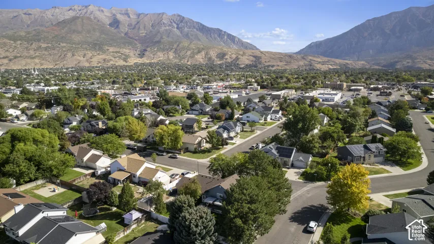 Residential community with mountainous backdrop and mature trees