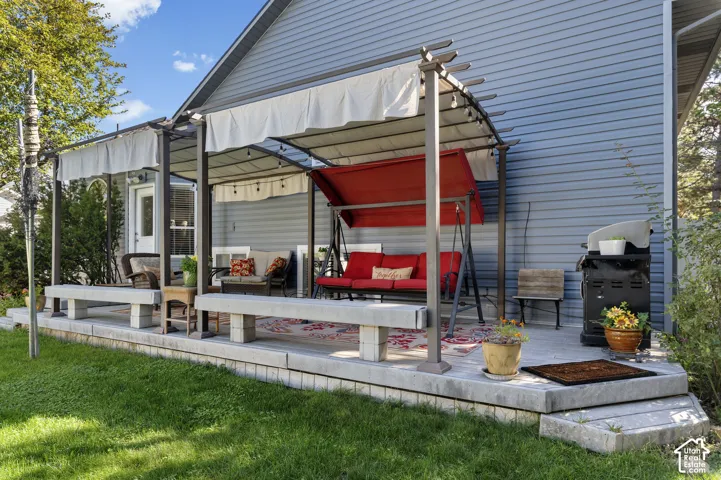 Exterior Trex deck with two pergolas, and brand new siding exterior