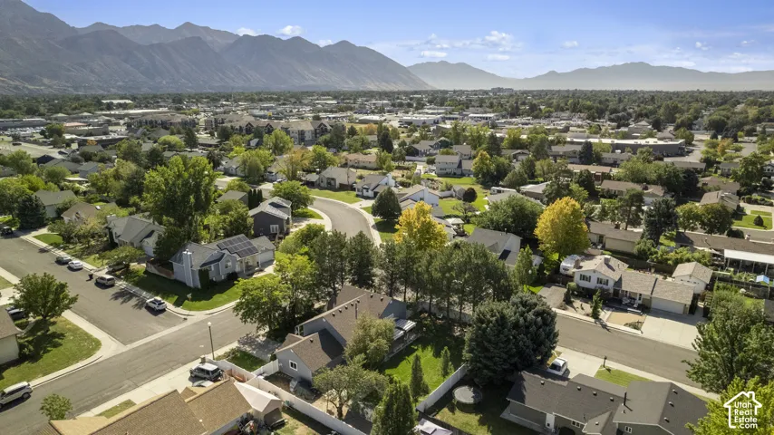Established neighborhood with mature trees and mountain scenery