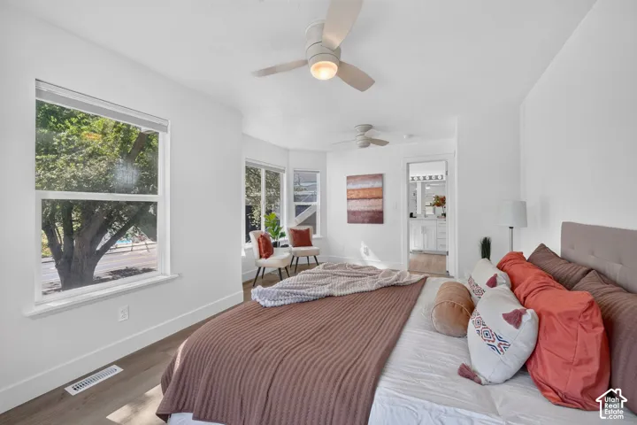 Recessed lighting throughout, wood-finish flooring, and multiple ceiling fans