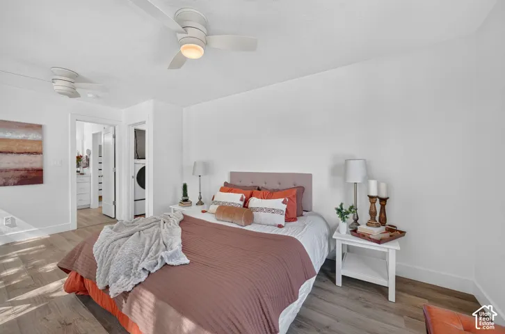 Recessed lighting, wood-finish flooring, and white walls