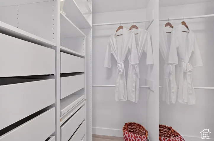 Built-in white cabinetry with full-extension drawers and integrated shelving