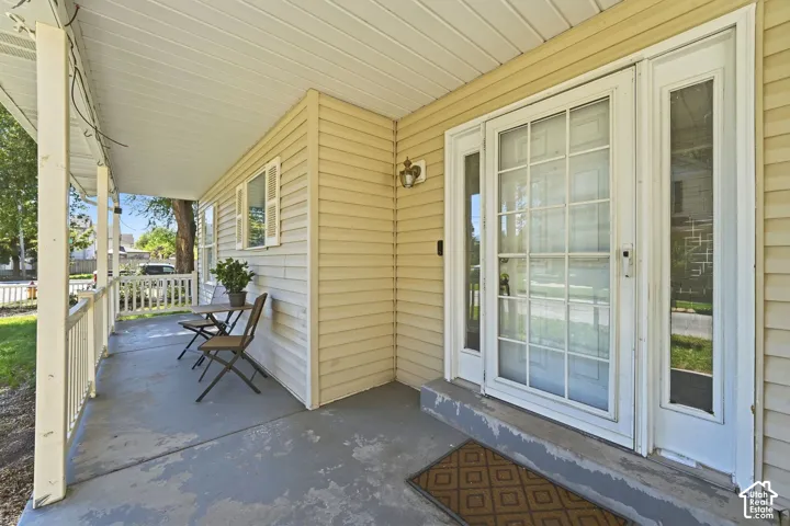 Covered front porch with a white railing system