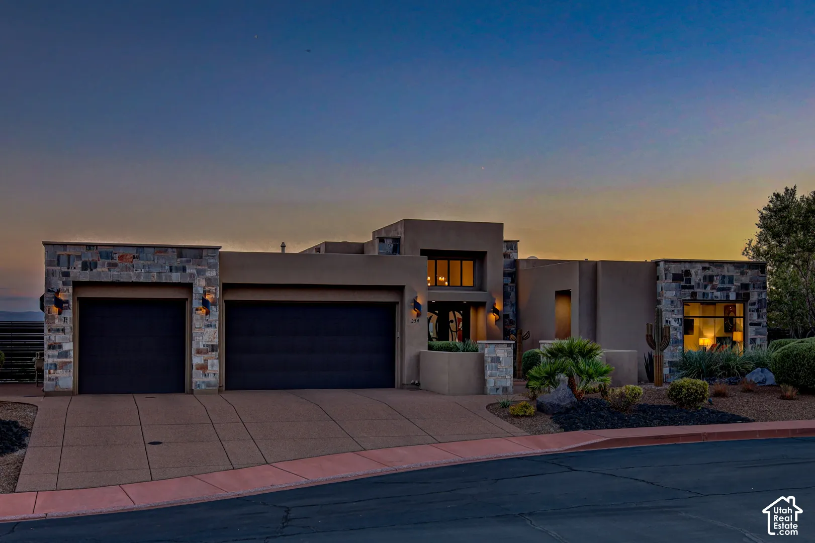 Contemporary exterior with stucco and stone accents