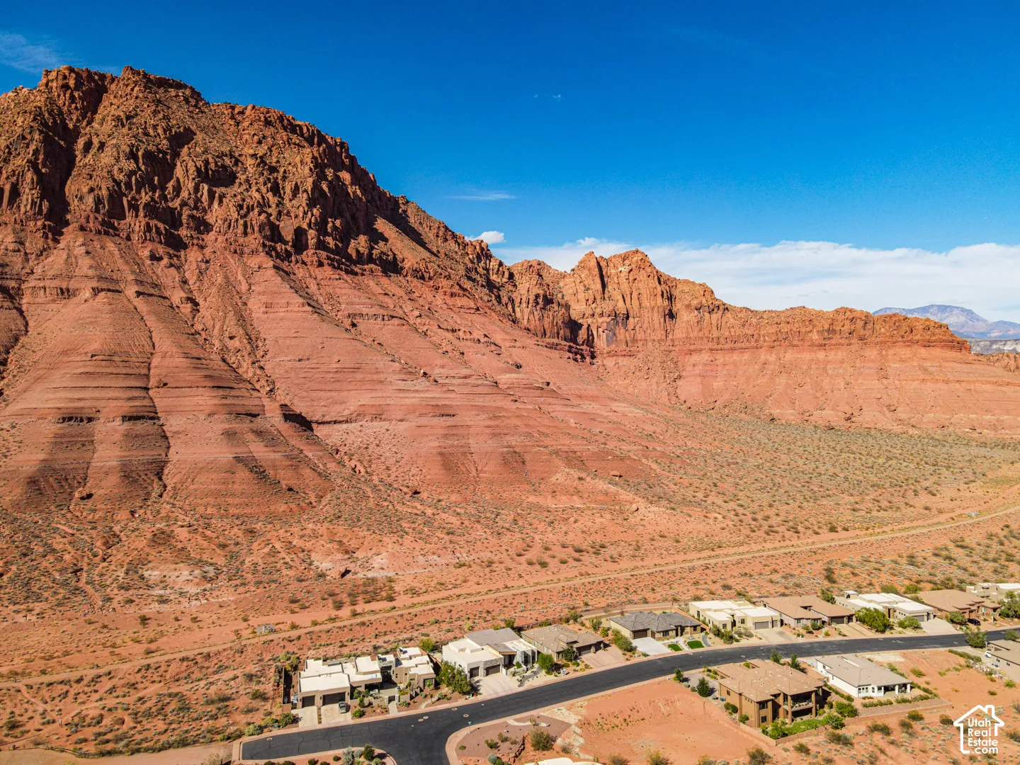 Natural rock formations provide a dramatic backdrop to a residential area