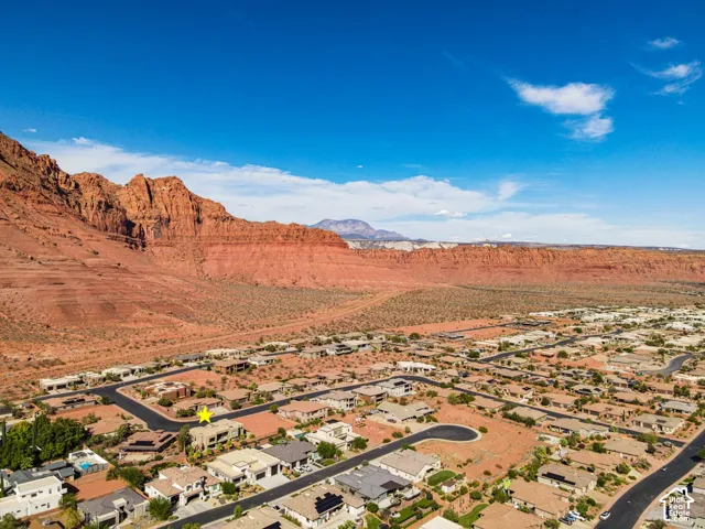 Community setting with red rock formations and desert landscaping