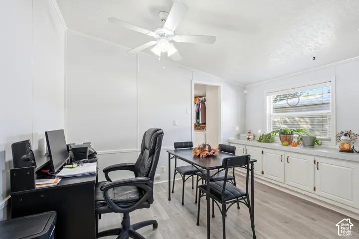 Recessed lighting, ceiling fan, wood-finish flooring, white built-in cabinetry, and a window with blinds