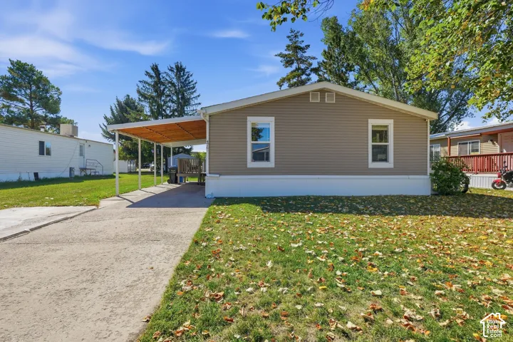 Neutral-toned siding exterior with white trim windows