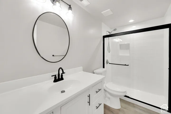 White vanity with an integrated sink and black faucet