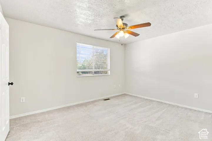 Neutral wall paint with textured ceilings