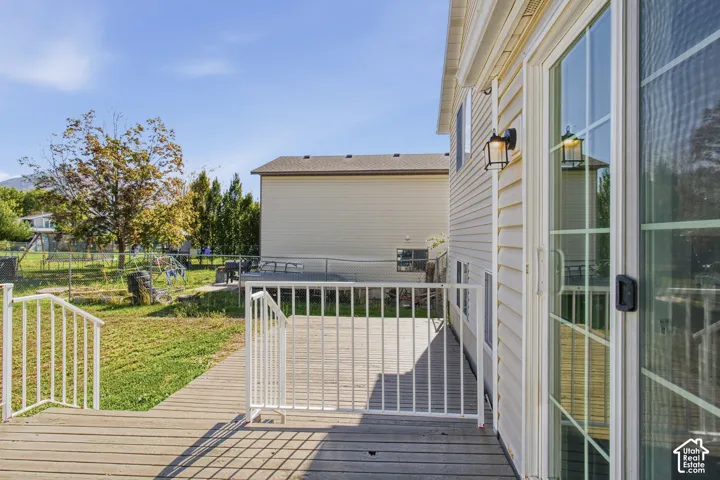 Wood-finish deck with white railings