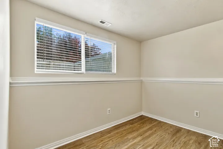 Warm neutral wall tones with decorative chair rail molding