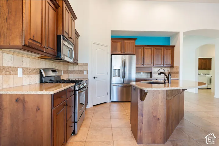 Wood-finish cabinetry paired with light-toned countertops
