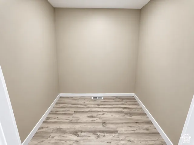 Wood-finish flooring with crisp white trim
