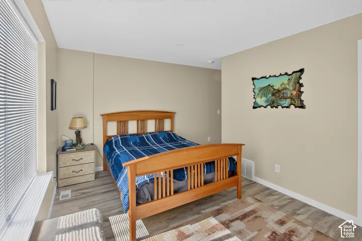 Neutral wall color, wood-finish flooring, and white trim