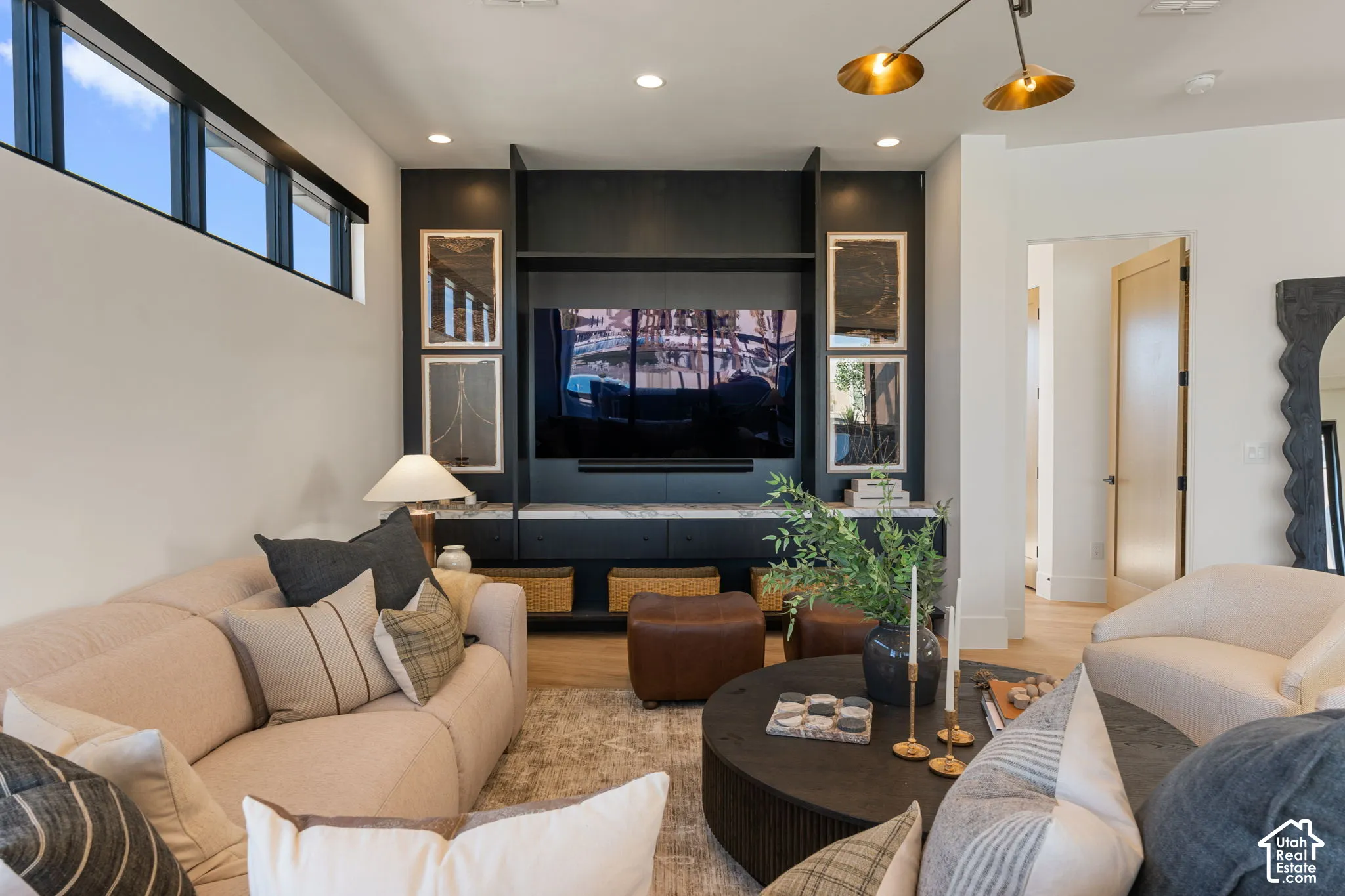 Built-in media center with dark cabinetry and stone-look countertop