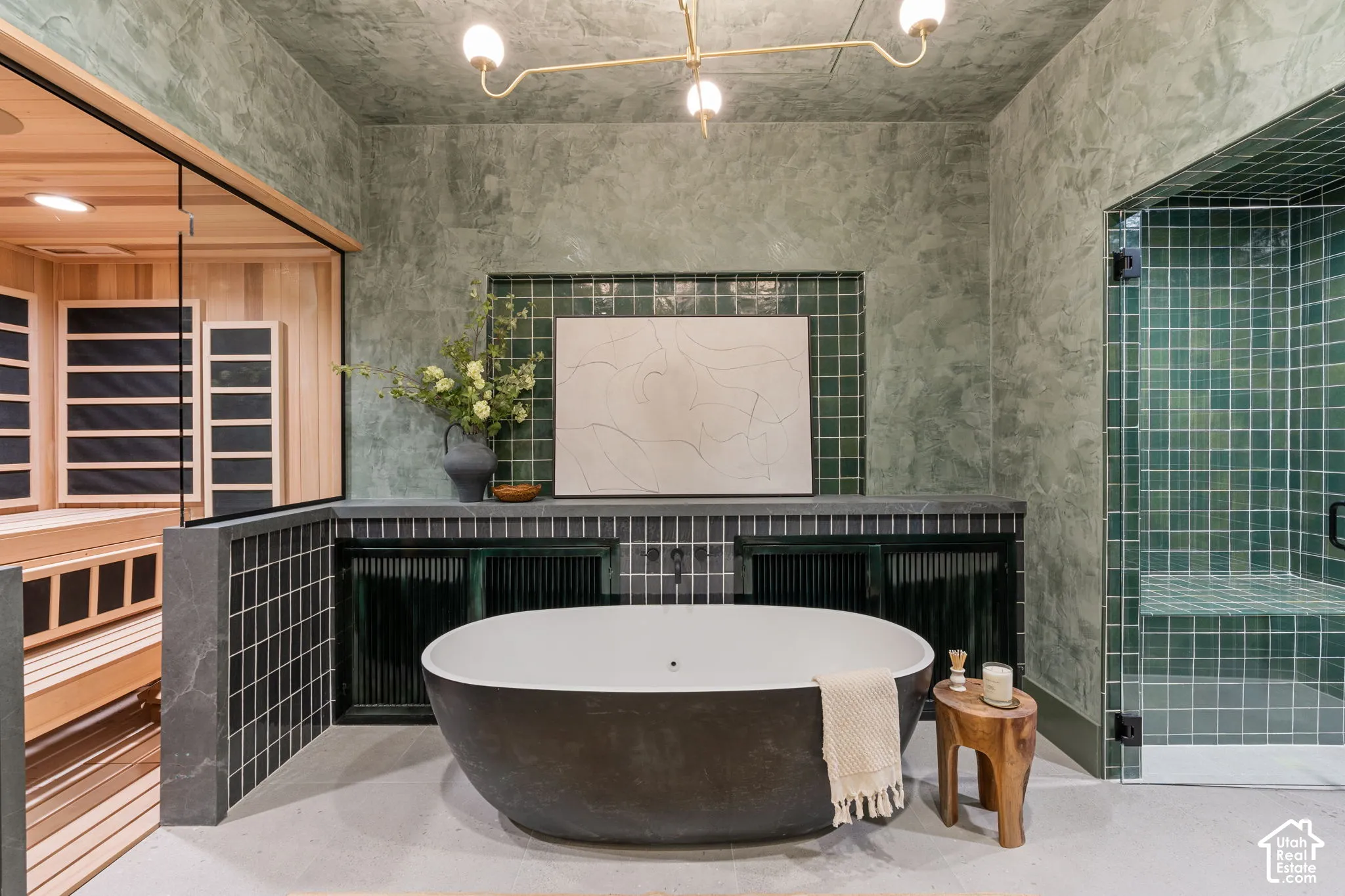 Freestanding soaking tub, walk-in shower with bench, built-in sauna, and custom vanity with integrated storage