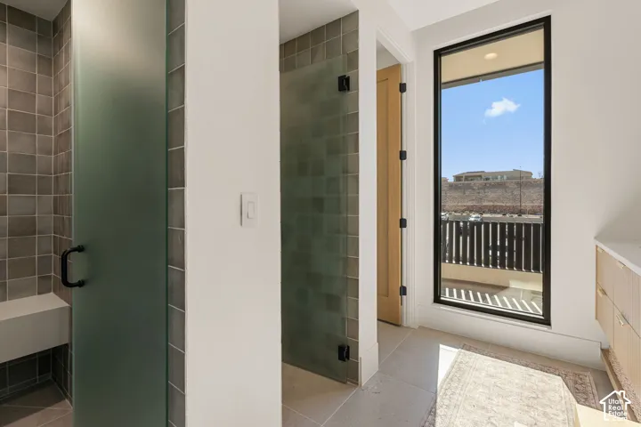 Frosted glass shower enclosure with a built-in bench