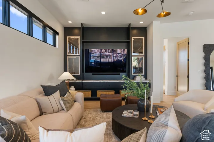 Built-in media center with dark cabinetry and stone-look countertop