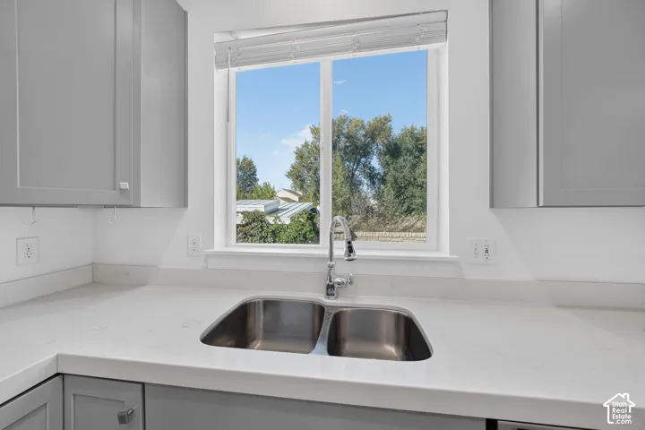 Dual basin stainless steel sink with a chrome faucet