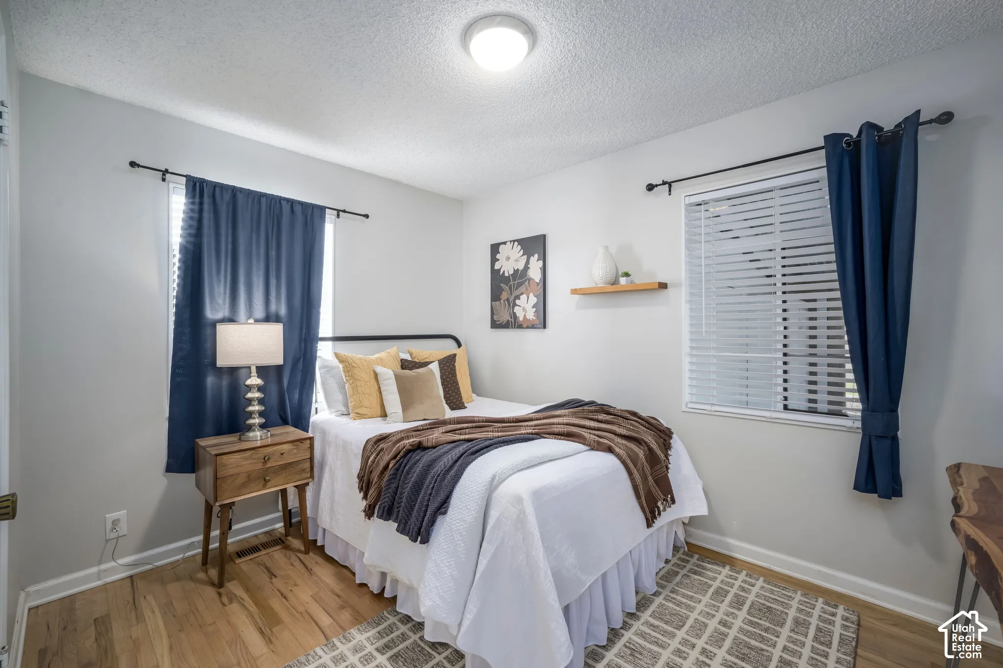 Wood-finish flooring with white baseboards
