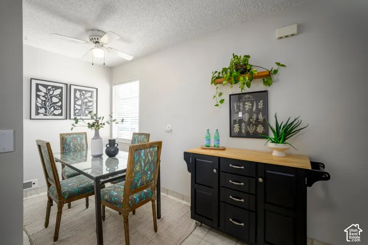 Recessed lighting, ceiling fan, window with blinds, light gray wall paint, and tile flooring