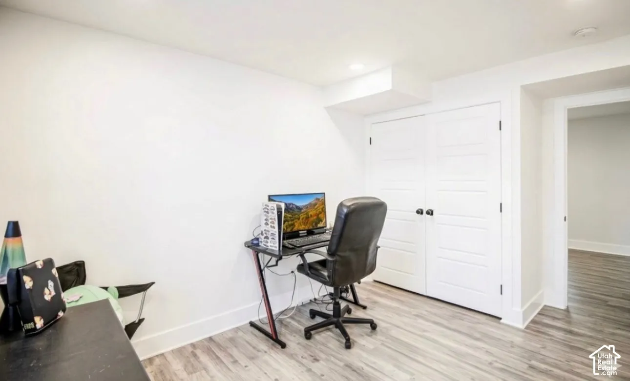White walls with wood-finish flooring