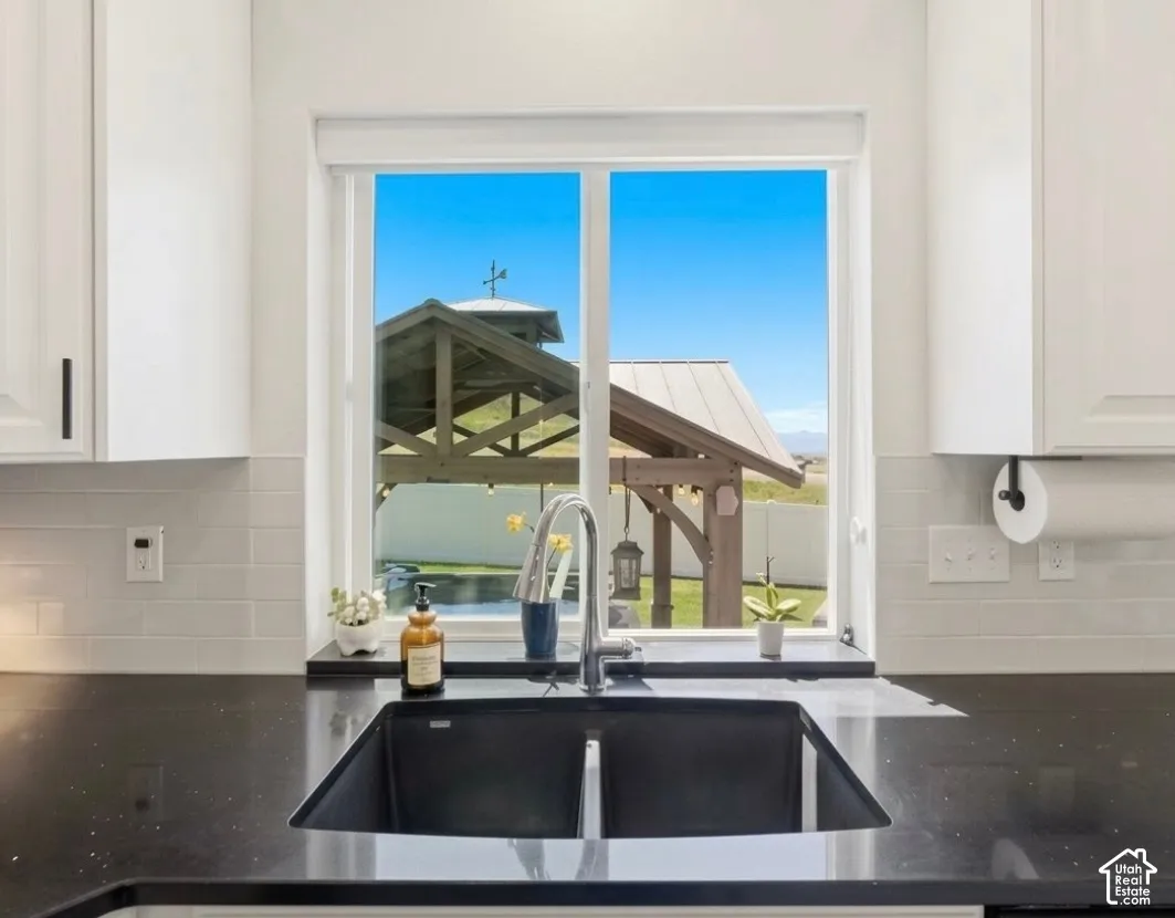 Sleek undermount double basin sink set into dark countertop
