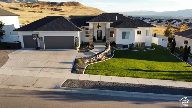 Contemporary exterior with dark asphalt shingle roofing and white stucco siding