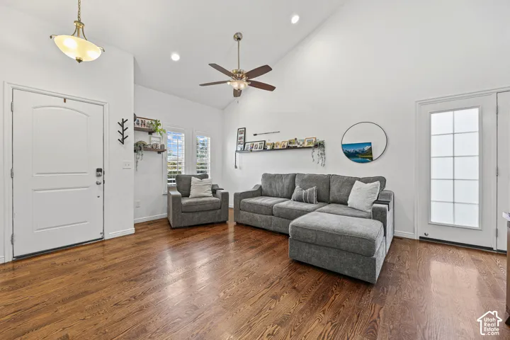 Spacious room with wood-finish flooring and vaulted ceilings