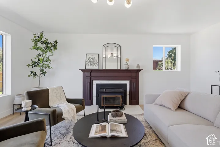 Fireplace with a dark wood mantel and white surround