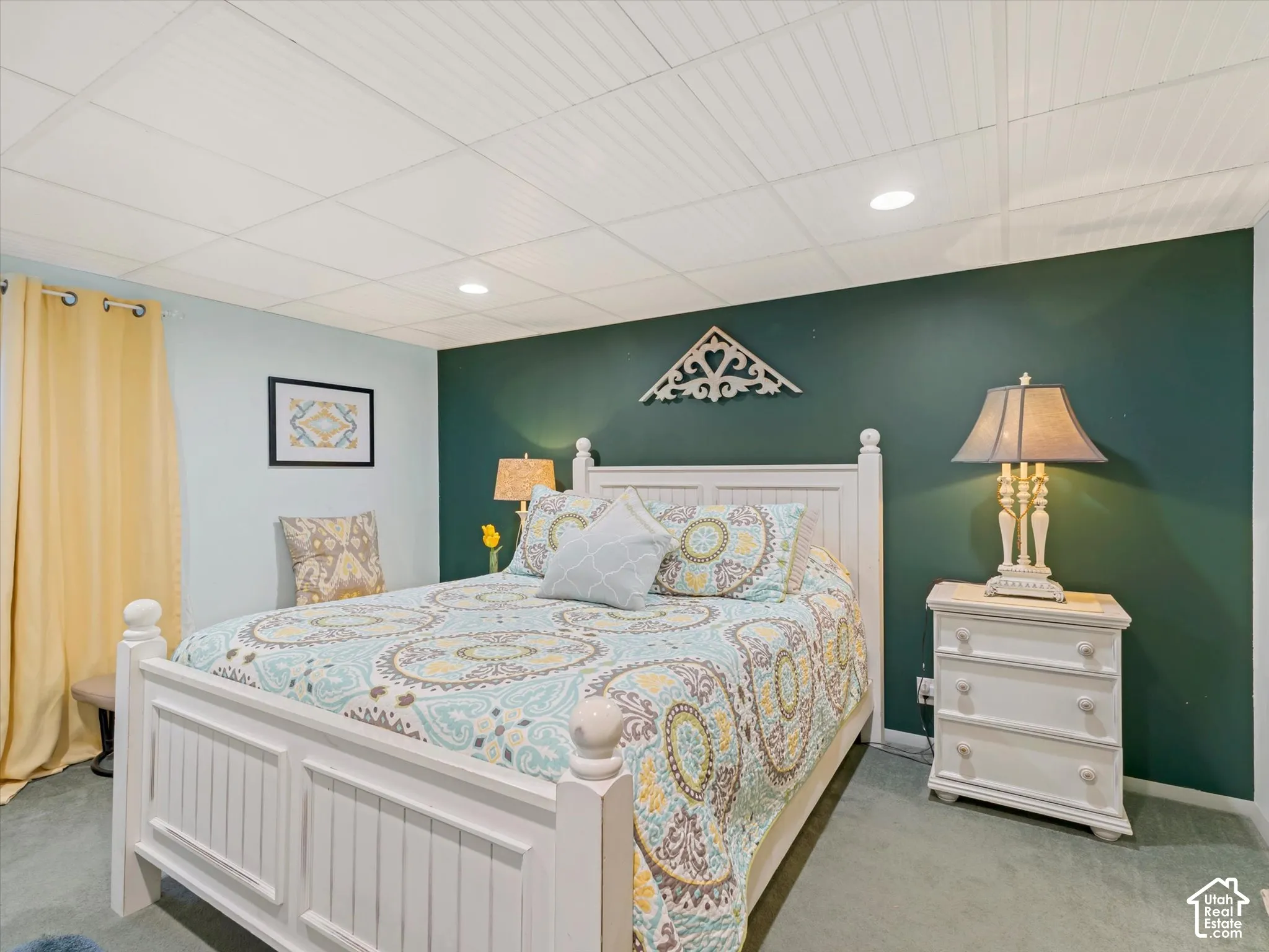 White beadboard ceiling, recessed lighting, and soft wall-to-wall carpeting