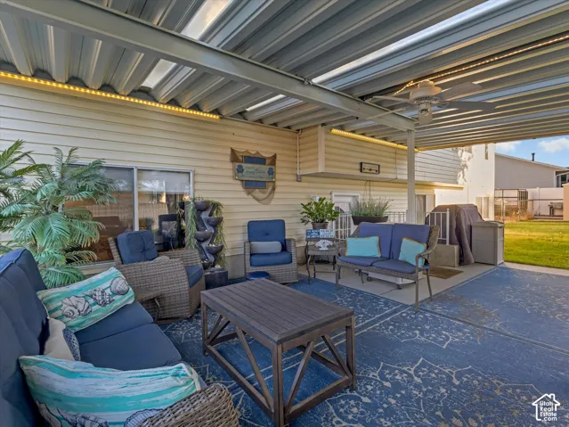 Covered patio featuring a ceiling fan, recessed lighting, and a water feature