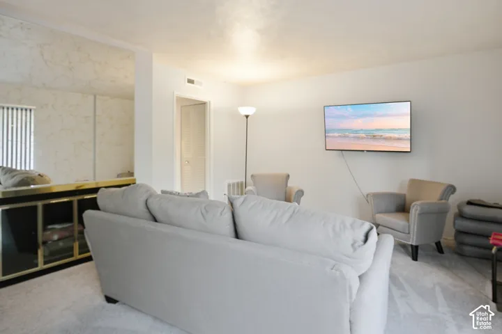 Wall-mounted television with visible wiring
