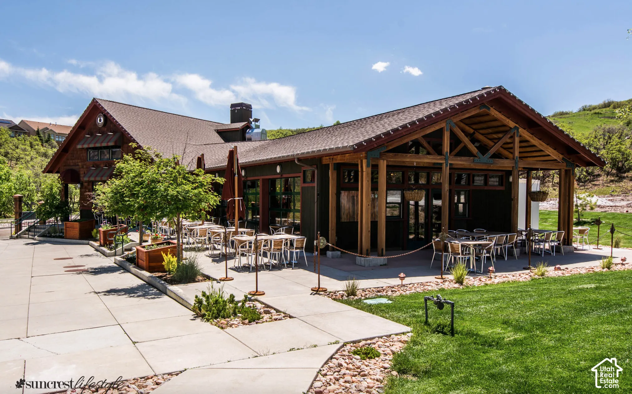 Expansive outdoor patio with a gabled roof and exposed wood beams