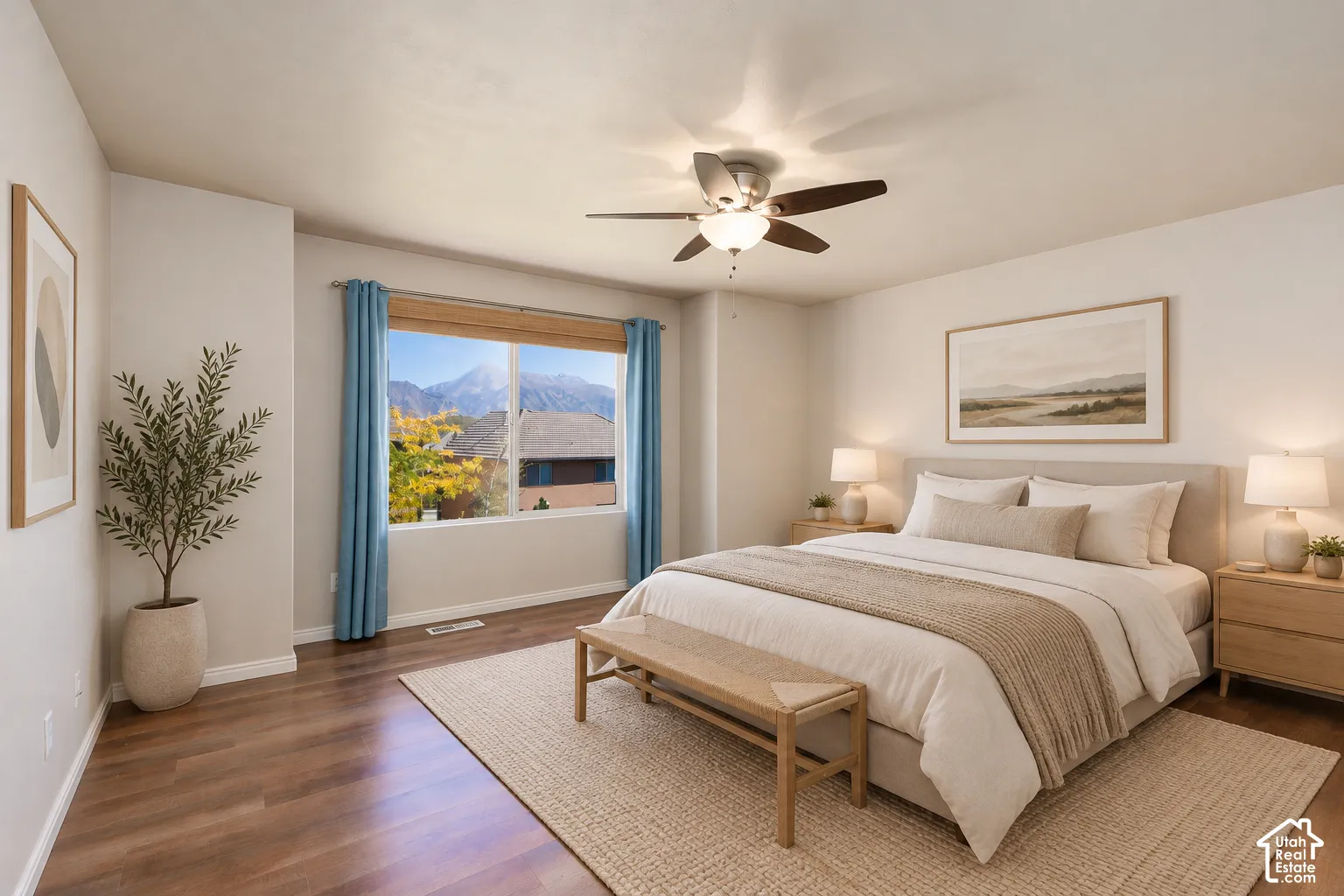 Wood-finish flooring with a large window featuring a mountain backdrop, ceiling fan, and recessed lighting