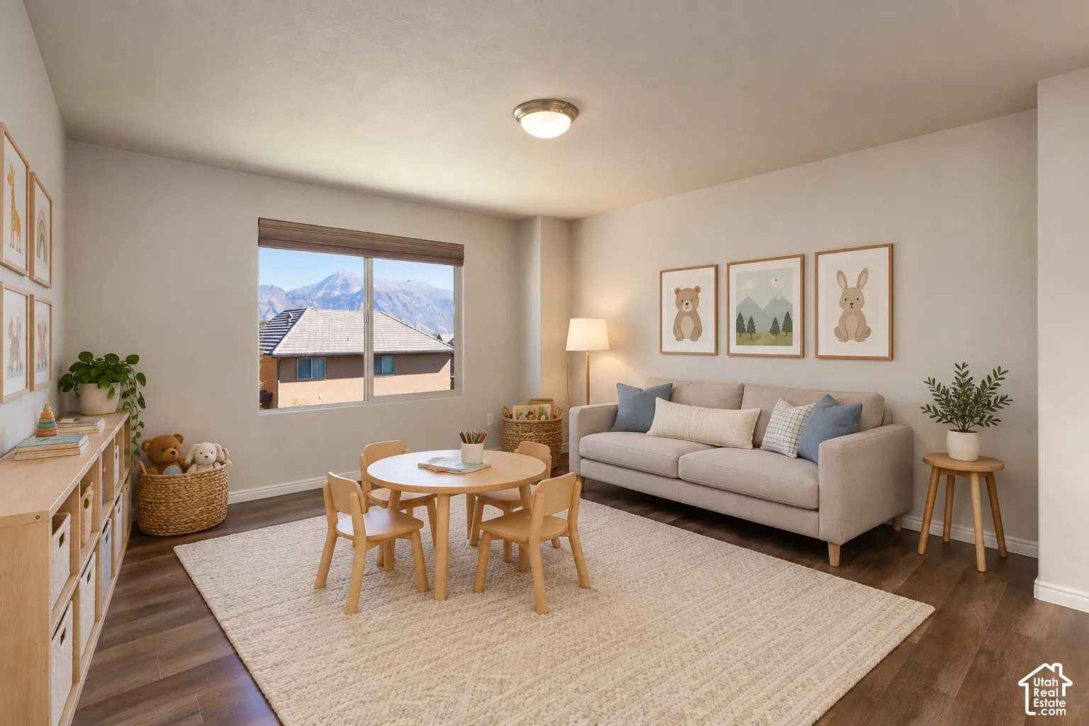 Bright room with wood-finish flooring, a large window, recessed lighting, and a neutral wall color