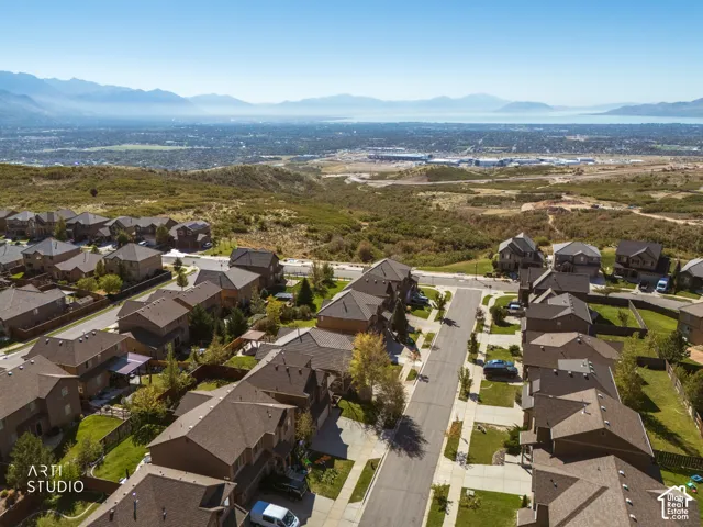 Residential neighborhood with a distant body of water and mountains