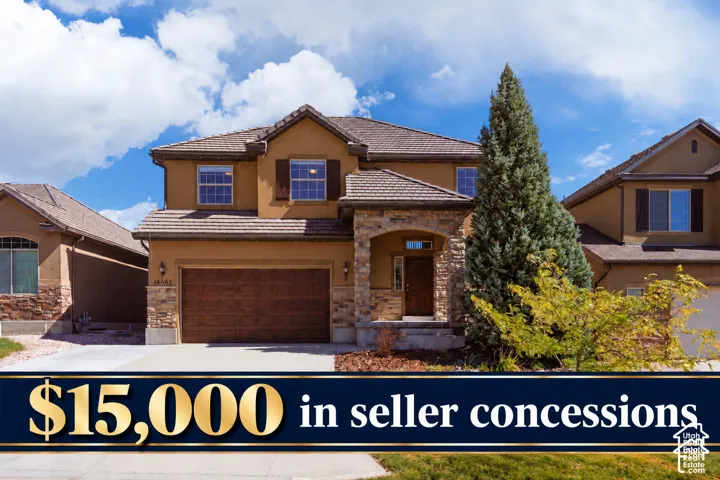 Two-story stucco exterior with stone veneer accents, concrete tile roof, attached two-car garage, and covered entryway