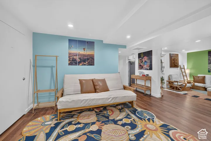 Recessed lighting illuminates the wood-finish flooring