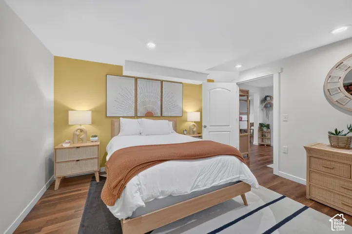 Warm wood-finish flooring with recessed lighting