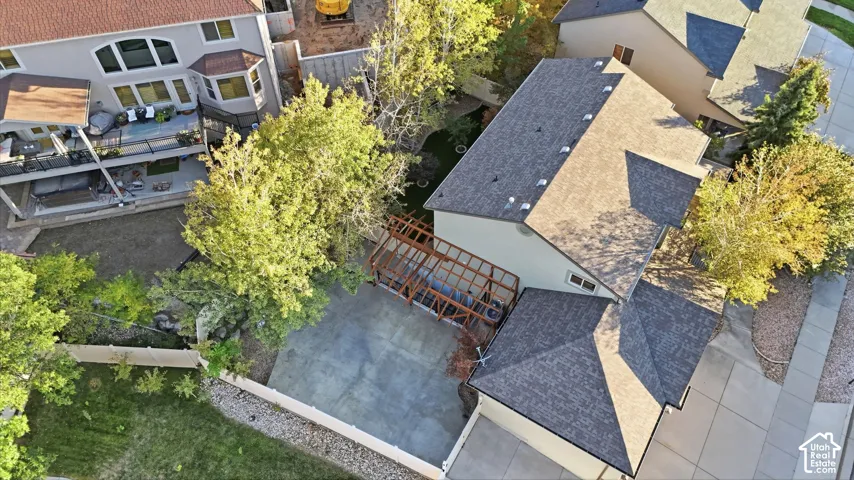 Two-story exterior with multi-level rear decks, a bay window, and a pergola